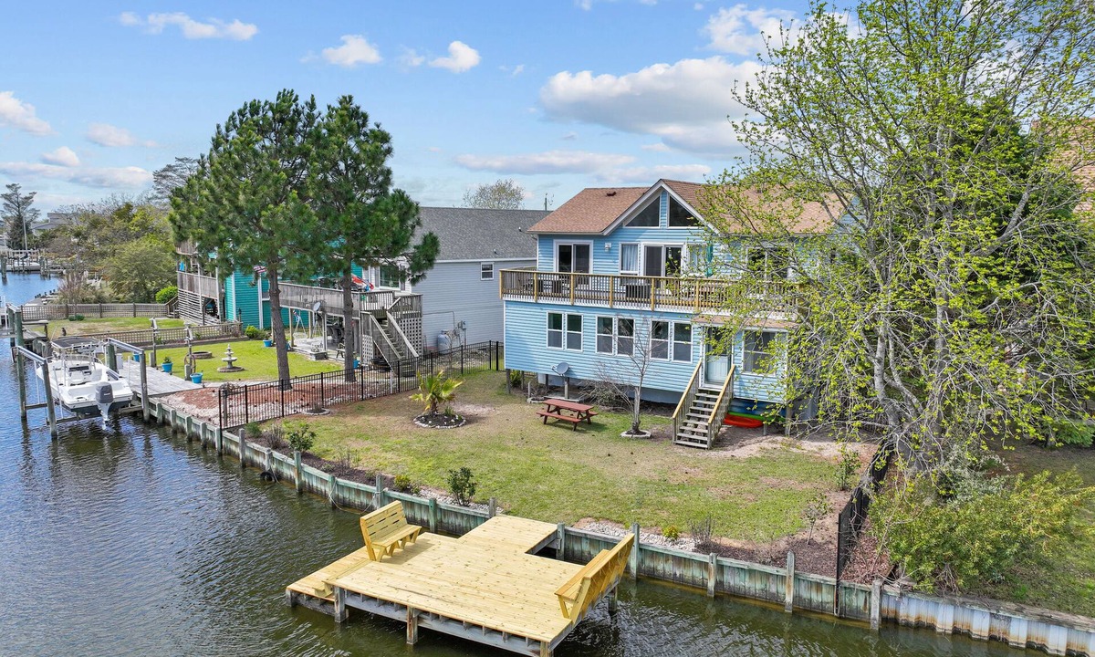 Colington Harbour House | 4BR dog friendly home with canal views, dock