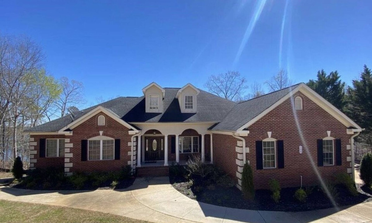 Fair Play House | Majestic Lakefront Home with private dock, basketball court, firepit, and more..