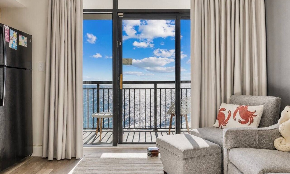 Windy Hill Condo | Oceanfront Condo Balcony with Resort Pool Hot Tub