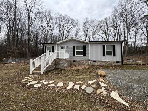 Alexis House | Peaceful Farmstead Cottage with Creekside Views Near Iron Station, North Carolina