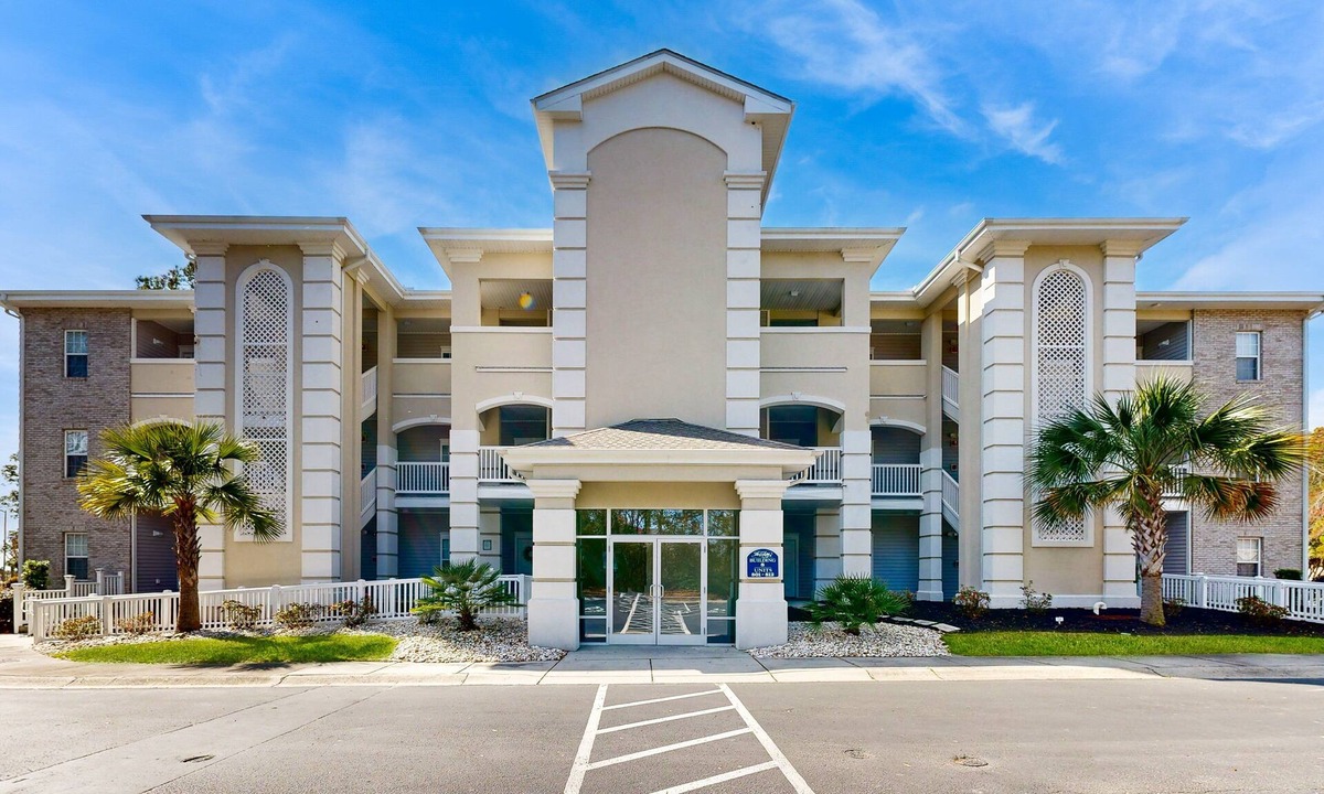 Sunset Beach Condo | SB61 Sunset Serenity: Sunny condo with a pool, balcony, kitchen, beach gear, W/D, & AC