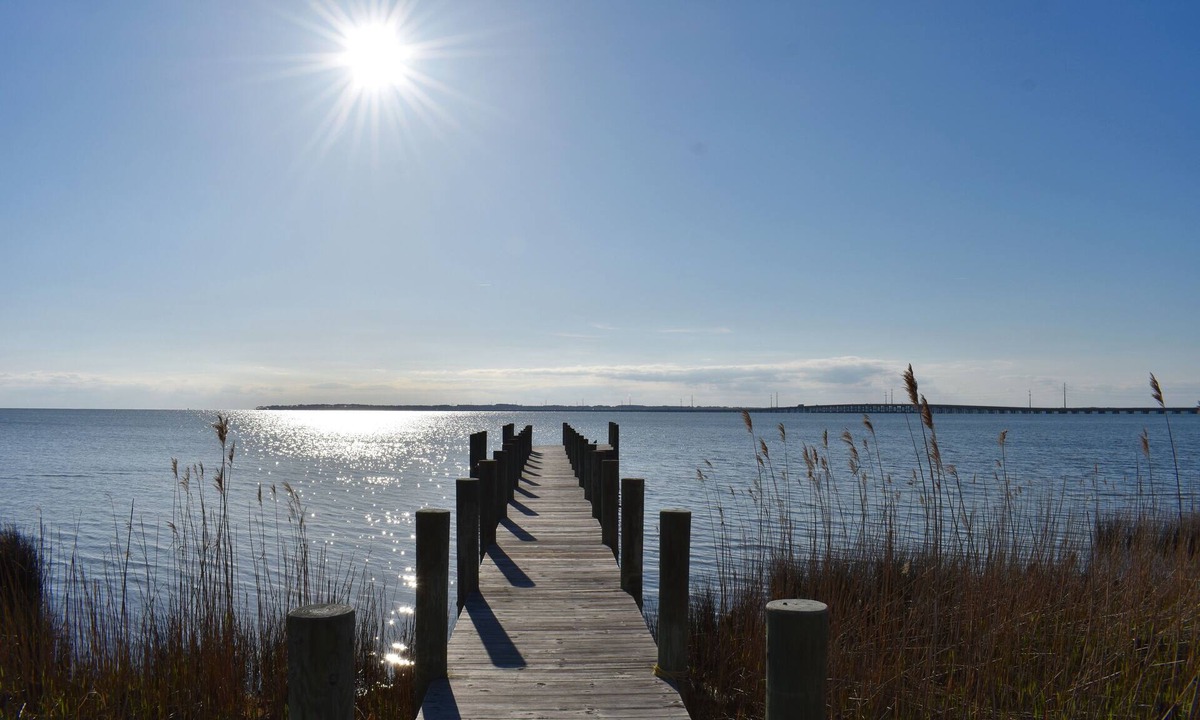 Kitty Hawk House | Soundfront sunsets, private dock, 4 king beds, screened porch, deck & bedrooms.