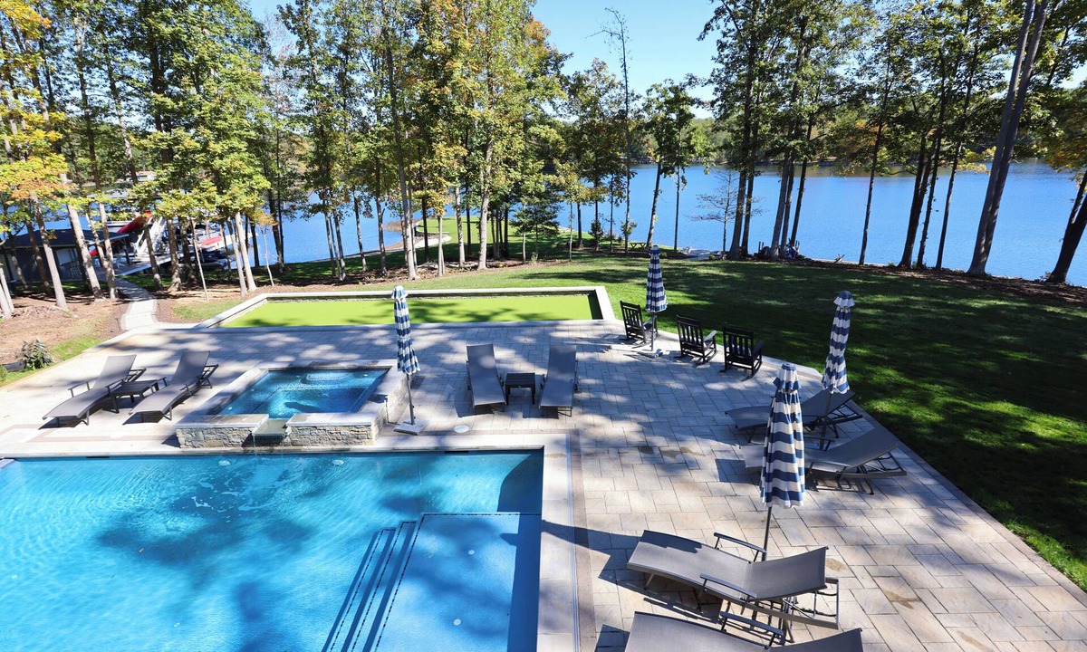Bumpass House | Stunning Lakefront Oasis w/Pool, Hot Tub, Dock, Waterslide, Beach - Public Side