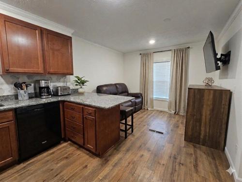 Phenix City House | Tiny Home with Grill Laundry Deck Desk