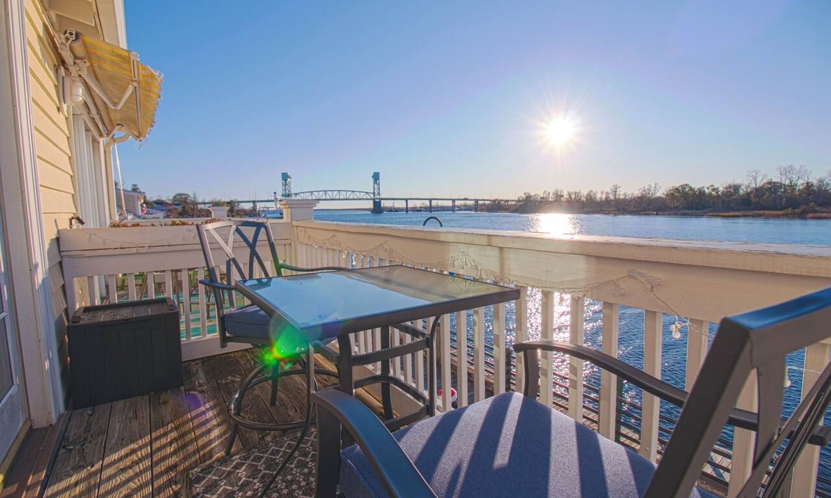 Wilmington Historic District Apartment | Waterfront Sunset Views in Port City Wilmington NC -King Bed & Balcony
