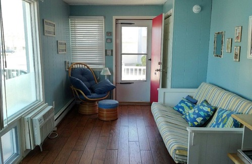 Stone Harbor Condo | 1st Floor Front Efficiency Unit, right side, corner Tables and chairs in the court yard.