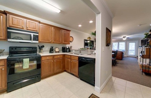 Helen Condo | 3BR Helen condo with 2 hot tubs, fireplace, riverfront deck