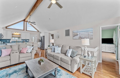 Colington Harbour House | 4BR dog friendly home with canal views, dock