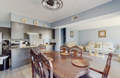 Little River House | All-suite Bay Tree retreat with al fresco dining, water views, and shared pool
