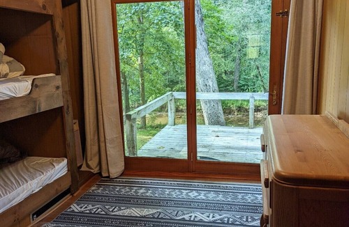 Harrisonville Cabin | Backyard creek, screened porch