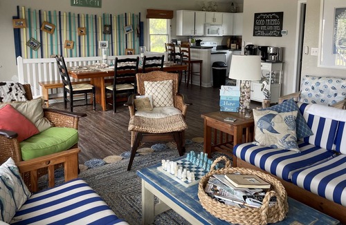 Carova Beach Cottage | Beautiful Canal front home in 4x4 area beach parking passes and linens included!