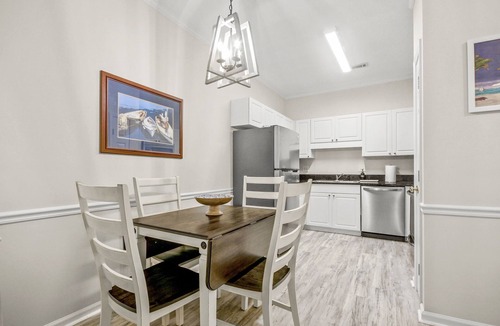 Vaught Condo | Beautiful condo with pool. 5 minute drive to beach. Sleeps 8. Pet friendly