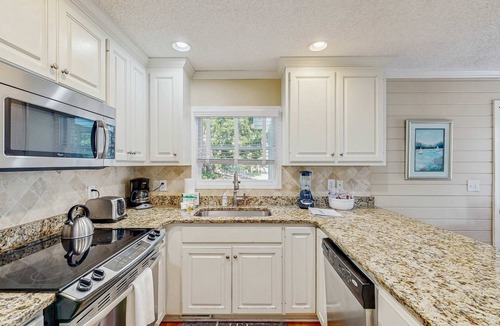 Pelican Bay House | Beautifully decorated cottage steps from the beach with pool & open layout