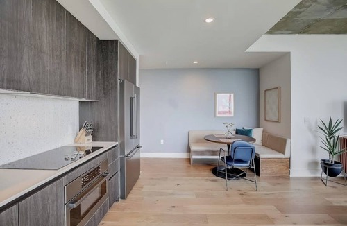 Rainey Street Historic District Condo | Brand-new skyline-view condo with rooftop pool, balcony, firepit, & fitness room