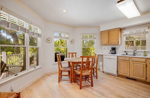 Pelican Bay House | Casual cottage w/screened porch & shared pool - walk to the beach