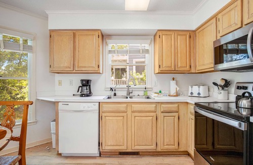 Pelican Bay House | Casual cottage w/screened porch & shared pool - walk to the beach