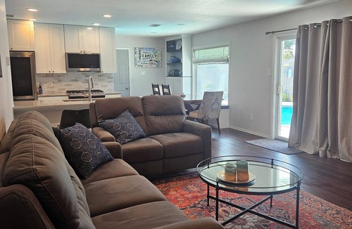 Haltom City House | Central DFW location with cozy fireplace and pool.