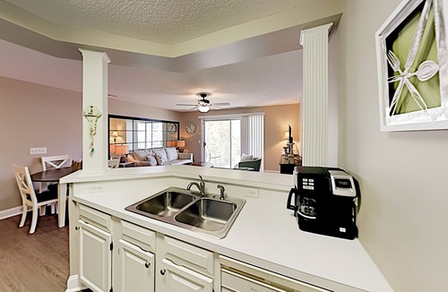 Sunset Beach Condo | Colony II at Oyster Bay Condo | Pool, Gym, Grill Areas & Hot Tub