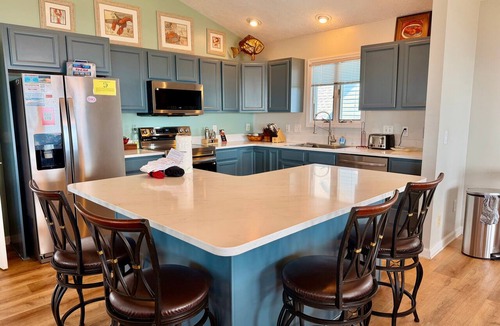 Long Beach Hotel | Coral House: Spacious oceanview retreat in Oak Island, NC, perfect for families.