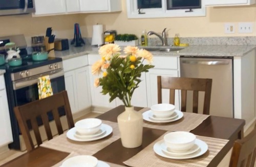 Greenville Condo | Cozy 2BR Retreat ,Gated Yard, Smart TVs & Coffee Bar!