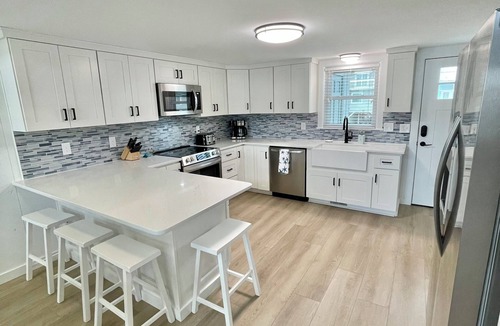 Ocean Isle Beach Cottage | Cozy 5BR-2.5BA Cottage on Canal, Private Heated Pool, Private Boat Dock