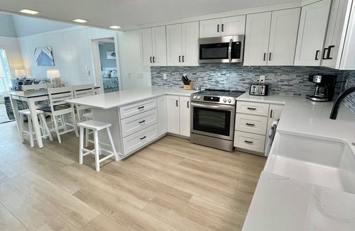 Ocean Isle Beach Cottage | Cozy 5BR-2.5BA Cottage on Canal, Private Heated Pool, Private Boat Dock