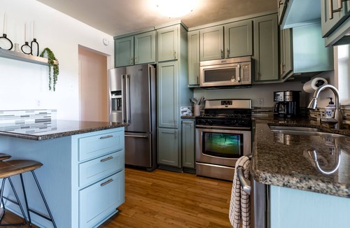 Galindo House | Cozy house, covered outdoor kitchen & living w/TV. Convenient location!