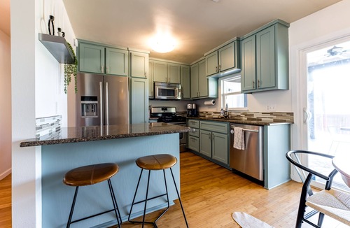 Galindo House | Cozy house, covered outdoor kitchen & living w/TV. Convenient location!
