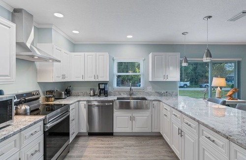 Indian Waters House | Crystal River Pool Home ~ Waterfront w/Boat Dock, Hot Tub & fenced backyard.