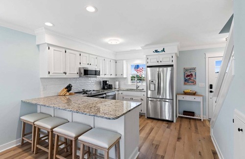 Holden Beach House | Discover Mom's Gift in Holden Beach: a 2-bed, 3-bath duplex for unforgettable family getaways.