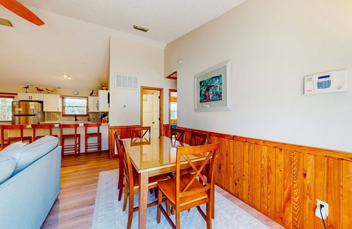 Sea Scape House | Dog-friendly coastal home with balcony, open layout, wood finishes, & AC