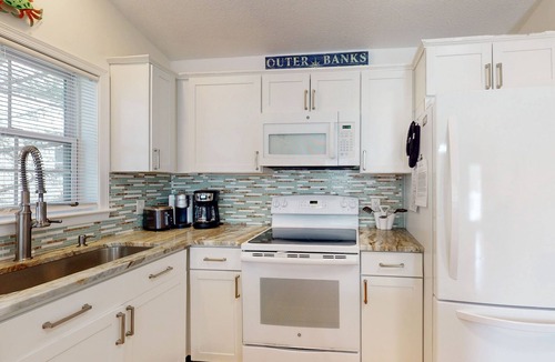 Colington Harbour House | Dog-friendly home with game room, furnished deck, & pool access