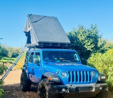 Paia Other | Embark on a journey through Maui with Aloha Glamp's jeep and rooftop tent allows you to discover diverse campgrounds, unveiling the island's beauty from unique perspectives each day