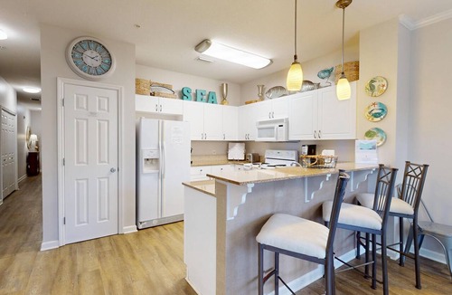Frangista Beach Condo | Emerald Waters 101 - pristine Gulf rental, pool, short walk to beach
