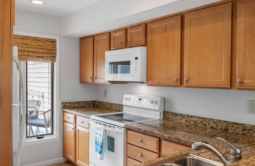 Spinnaker Beachhouses Villa | Great Location! Walk to Beach, Club, Golf, Pools! Distant Ocean Views! Amenity access included!