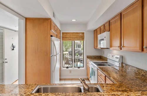 Spinnaker Beachhouses Villa | Great Location! Walk to Beach, Club, Golf, Pools! Distant Ocean Views! Amenity access included!