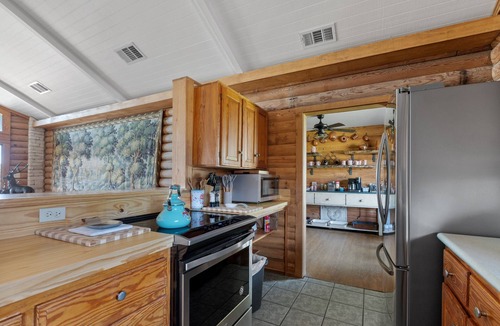 Kerrville House | Guadalupe Bluff Log Cabin - Hot tub - Guadalupe River View