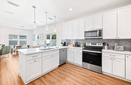 Butler Beach House | Heated Pool Oasis Arcade + Games Walk to Beach