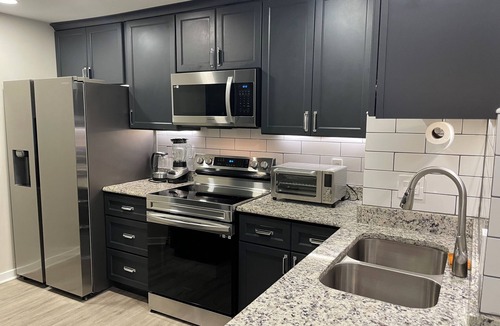 Trinity Vicinity Condo | Historic 2026 Summer Hub: Steps to Train, World Cup & Jazz Fest!