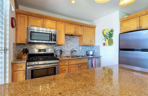 Historic Kailua Village Condo | Kona Mansions | Short stroll to Honl’s Beach