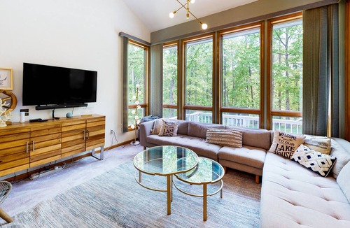 Lakeside Woods House | Lakefront home with hot tub, WiFi, dock, lake views, AC, & wood fireplace