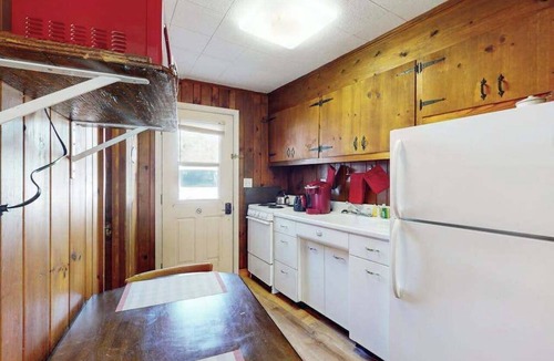 Flat Rock Condo | Lakeview pet friendly studio with pool, fire pit, canoes & paddle boats, & WiFi