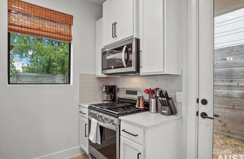 Rosewood House | Luxe King Primary + Comfort and Cool Shaded Patio