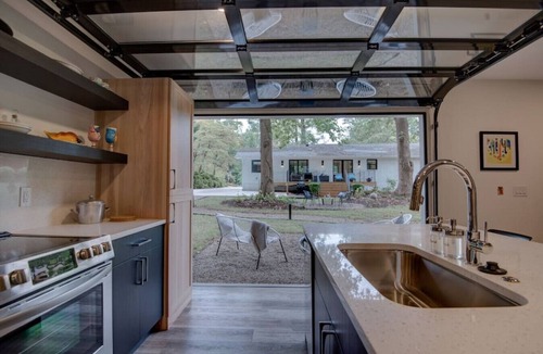 Charlotte House | Luxurious Guest House Retreat in Lower South End w/retractable glass garage door