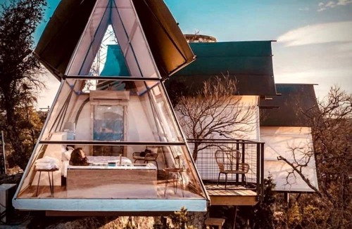 Cottonwood Shores Cabin | Luxury Glass A-Frame Escape with Cliffside Balcony & Spa Features in Cottonwood Shores, Texas
