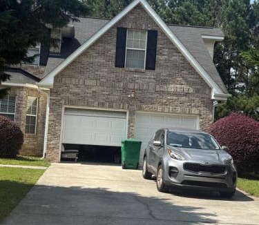 Lithonia House | Master bedroom with full bathroom