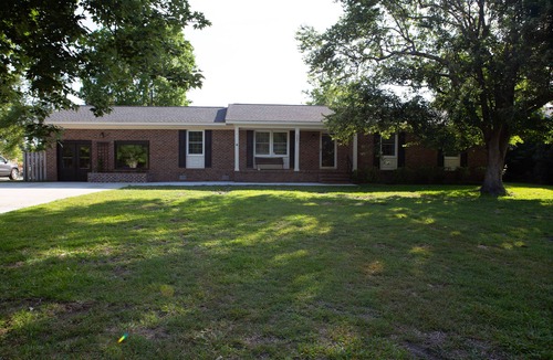 Wilmington House | Oasis in the middle of town for large groups with pool and 2 Master bedrooms.