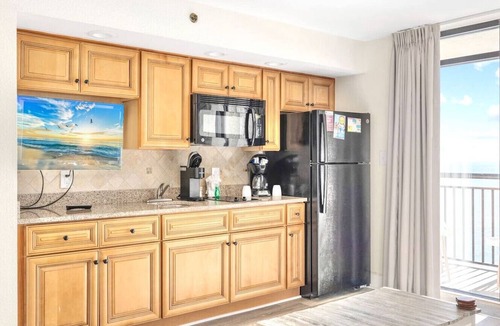 Windy Hill Condo | Oceanfront Condo Balcony with Resort Pool Hot Tub