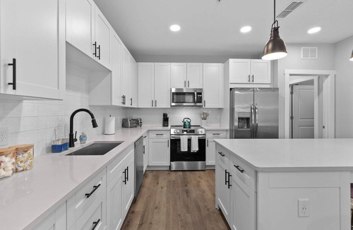 Deerwood Apartment | Palm Paradise: Tropical 2BR/2BA with Pool & Gym