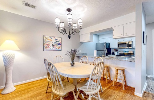 Ocean Ridge Condo | Peaceful & sunlit coastal escape with patio, AC, & W/D - near trails & the beach